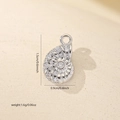 Detailed view of sea snail pendant with dimensions 1.5cm by 0.9cm and zircon inlay - White Gold (MYCDNE558)