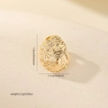 Macro view of a gold conch shell pendant with zircon inlays and detailed spiral texture - Gold (MYP15977)