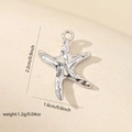 Macro view of silver starfish pendant showing detailed 2.2cm height and 1.6cm width dimensions - Glossy White Gold Sea Star (White Gold MYLP-3822(i-D2))