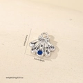 Macro detail of silver shell pendant with blue zircon stone and dimensions info - Silver Bowknot Shell Style (MYCBK3651)