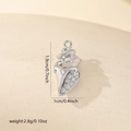 Macro detail of silver conch pendant showing dimensions 1.9x1.0cm and cubic zirconia inlay - Zirconia Inlaid Conch (MYCDNE560) / Silver