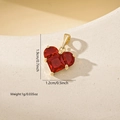 Macro shot of red heart zircon pendant with dimensions 1.9cm x 1.2cm and weight 1g - Gold Red