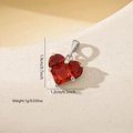 Macro view of heart-shaped red zircon pendant showing 1.9cm height and 1.2cm width - Silver Red