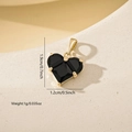 Detailed size specifications for a gold heart pendant with black zircon in a macro view - Gold Black
