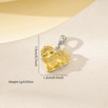Macro shot showing dimensions of yellow zircon heart pendant with silver metal base - Platinum Yellow