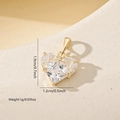 Macro detail of gold-plated heart pendant with zircon showing 1.9cm height measurements - Gold White
