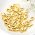 Golden metal lobster clasps for DIY jewelry making displayed on a white ceramic plate - 10mm / Gold