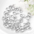 Polished silver metal lobster clasps for DIY jewelry making on white ceramic background - 10mm / White Gold
