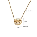 Gold necklace featuring round shell pendant with diamond-set X-cross design element - Round Zirconia Necklace