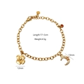 Detail of gold chain bracelet with moon and flower charms showing 17+3cm length - Clover Moon Charm Bracelet / Bracelet