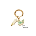 Detail showing a 13mm gold titanium earring with whale and bottle enamel charms - Little Bottle and Whale Pendant Style (7)