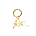 Detail view of gold hoop earrings with mother-of-pearl cross and yellow starfish charms - Cross and Starfish Pendant Style (8)