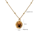Detailed view of tiger eye stone pendant necklace with 40+5cm gold chain dimensions - Multi-Faceted Irregular Style (Yellow Tiger Pendant 2)