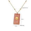 Detail of pink stone rectangular necklace with golden sunburst inlay and pearl bead - Pink Stone Square Plate Pendant