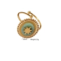Detail of bohemian star engraved green stone ring showing size 18mm and 2.3g weight - Amazonite
