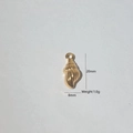 Golden conch shell pendant measuring 20mm by 8mm with spiral texture details - Gold Conch (4)