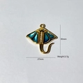 Detail of a 30mm gold stingray pendant with blue enamel and sparkling white zircons - Cyan Stingray Style (4)