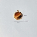 Detail showing 18mm tiger eye stone heart pendant with gold plated stainless steel frame - Gold Round With Tiger Eye Stone