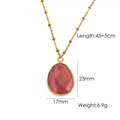 Detail of pink natural stone drop pendant with faceted surface and golden ball chain - Rhodochrosite Necklace