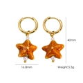 Detail view of 40mm starfish drop earrings with golden hoops and orange ceramic charms - Orange Spotted Starfish Style (10)