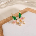 Macro shot of nature-inspired gold earring with green, pink, and white cubic zirconia - Green