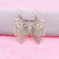 Elegant rose gold owl drop earrings featuring intricate hollow metal craftsmanship - Rose Gold