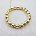 Bracciale elastico con perle metalliche placcate in oro 14K e finitura lucida - Oro 10mm