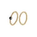 Detail of beaded gold-tone rings featuring a set with a faceted black gemstone accent - Black 2-Piece Set