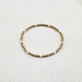 Close-up of handmade stretch bracelet featuring gold stainless steel beads and white stones - Minimalist Beaded Style (YB1016-WHT)