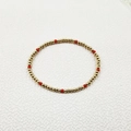 Detail of beaded bracelet with gold stainless steel beads and red faceted crystals - Minimalist Beaded Style (YB1016-RED)