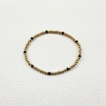 Detailed view of elastic handmade bracelet with gold steel beads and black faceted crystals - Minimalist Beaded Style (YB1016-BLK)
