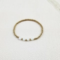 Detailed close-up of gold beaded elastic bracelet with multifaceted white crystal accents - Single Beaded Bracelet (YB1015-WHT)