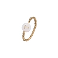 Macro shot of gold beaded elastic ring featuring a white shell disc with letter T engraving - Letter T (JZ-1088-T)