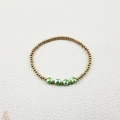 Detail of gold beads and green faceted crystals on a stylish stretch beaded bracelet - Single Beaded Bracelet (YB1015-GRN)