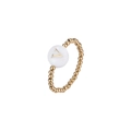Close-up of golden beaded elastic ring featuring a white shell bead with a gold letter V - Letter V (JZ-1088-V)