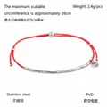 Detail of red woven cord bracelet showing PVD plated stainless steel beads and 26cm adjustable length - Red