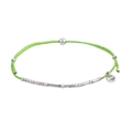 Close-up of green woven cord bracelet featuring silver beads and engraved S.Steel tag - Green