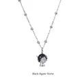 Macro detail of natural black agate stone pendant with silver leaf-shaped holder and bead chain - Black Agate Leaf Pendant (YN-1011S-BLK) / Silver