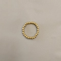 Detail shot of a minimalist gold stainless steel beaded ring on a textured grey background - Gold Tone 3mm Men's Style (JZ-1168G-3mm Men's Style)
