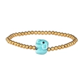 Detail of beaded bracelet with golden beads and a blue ceramic elephant charm - Gold Turquoise Elephant