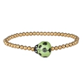 Close-up of golden stainless steel beads and green ceramic ladybug charm on the bracelet - Gold Green Ladybug