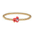 Macro detail of elastic gold bead bracelet featuring a handcrafted red bird ceramic pendant - Gold Red Duck