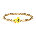 Close-up of golden beaded stretch bracelet featuring a small yellow duck charm - Gold Yellow Duck