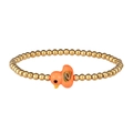 Close-up of golden beaded bracelet featuring a cute orange ceramic duck charm - Gold Orange Duck