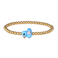 Close-up of golden beaded bracelet featuring a cute blue ceramic bird charm for girls - Gold Blue Bird Pink Wings
