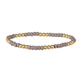 Vue détaillée des perles polies grises et dorées sur un bracelet élastique minimaliste - Gris (Perles Dorées)