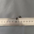 Detailed macro view of two 5mm polished black beads against a metric measuring ruler - Ball Screw Nut (7mm) / 1 Piece / Black