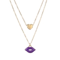 Close-up of double-layer gold chain with heart pendant and purple enamel lip charm - Gold Purple
