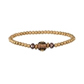 Detalle de pulsera de leopardo con cuentas de metal dorado y adornos de cristal fino - Cuentas Doradas con Esfera de Strass