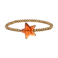 Dettaglio del bracciale a sfere dorate con pendente a stella ambra e trama marmorea interna - Perline d'Oro con Ciondolo Stella Ambra